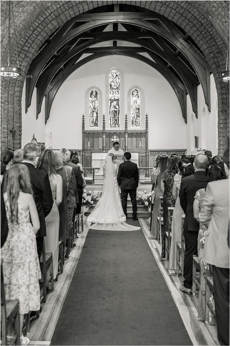 Bride and groom stand at altar for Maine Coastal Wedding
