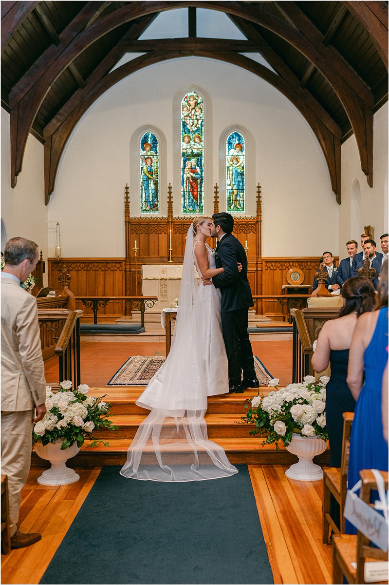 Couple share their first kiss at Maine Coastal Wedding
