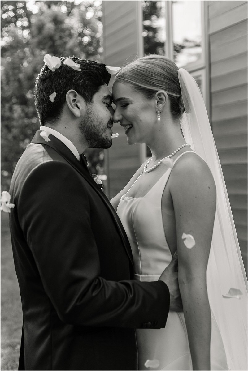 Bride and groom hold one another close for Maine Coastal Wedding
