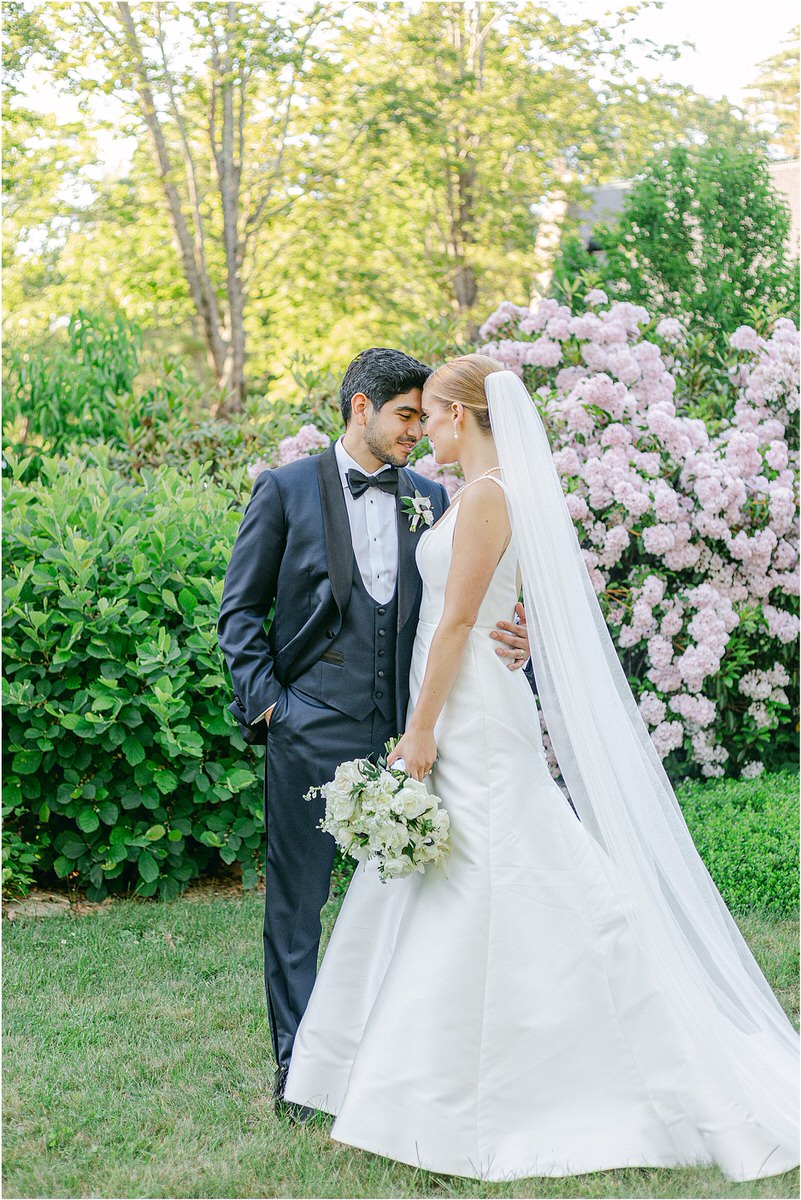 Man and woman stand together in wedding day attire for Rachel Campbell Photography