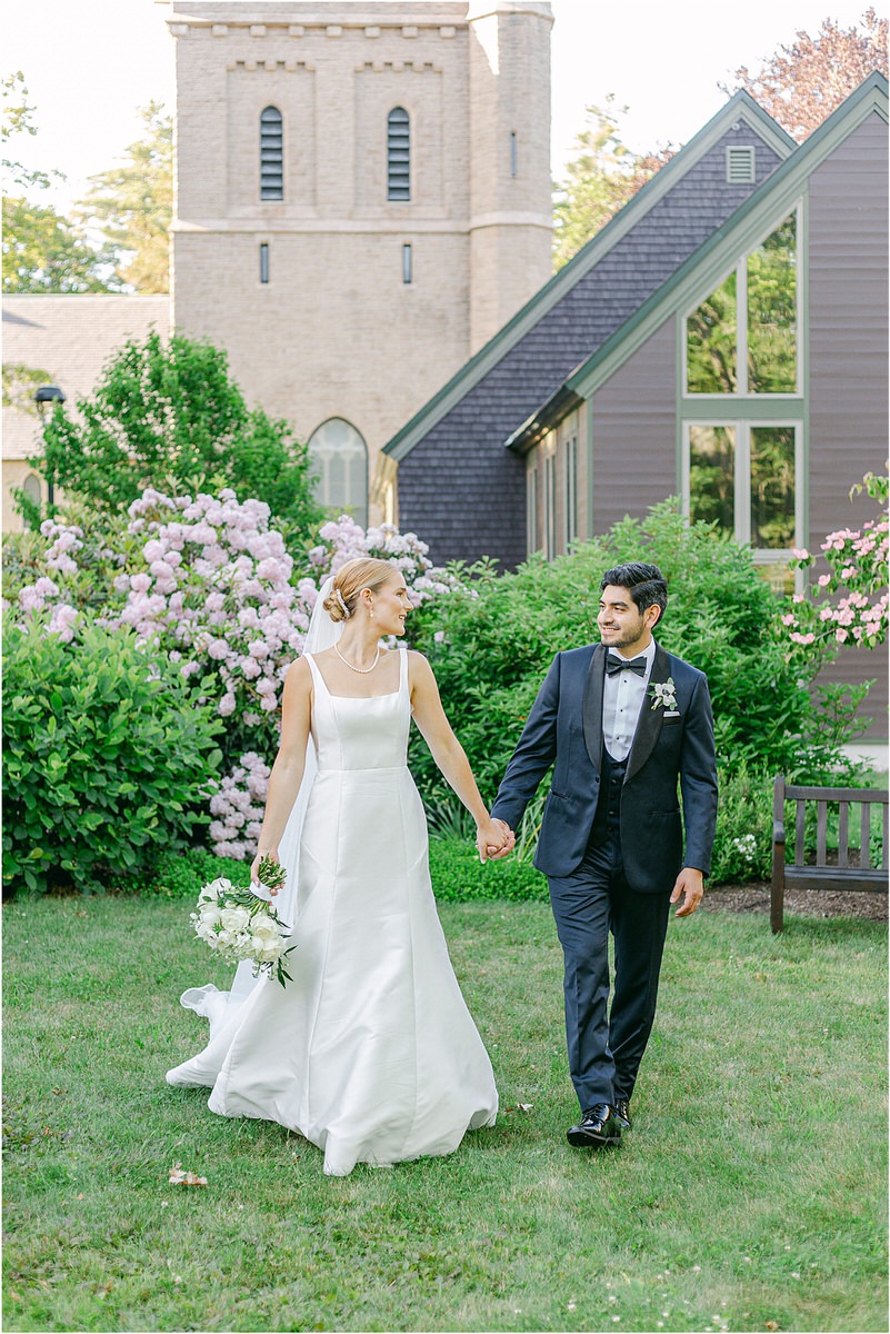 Couple hold hands and walk together for Rachel Campbell Photography
