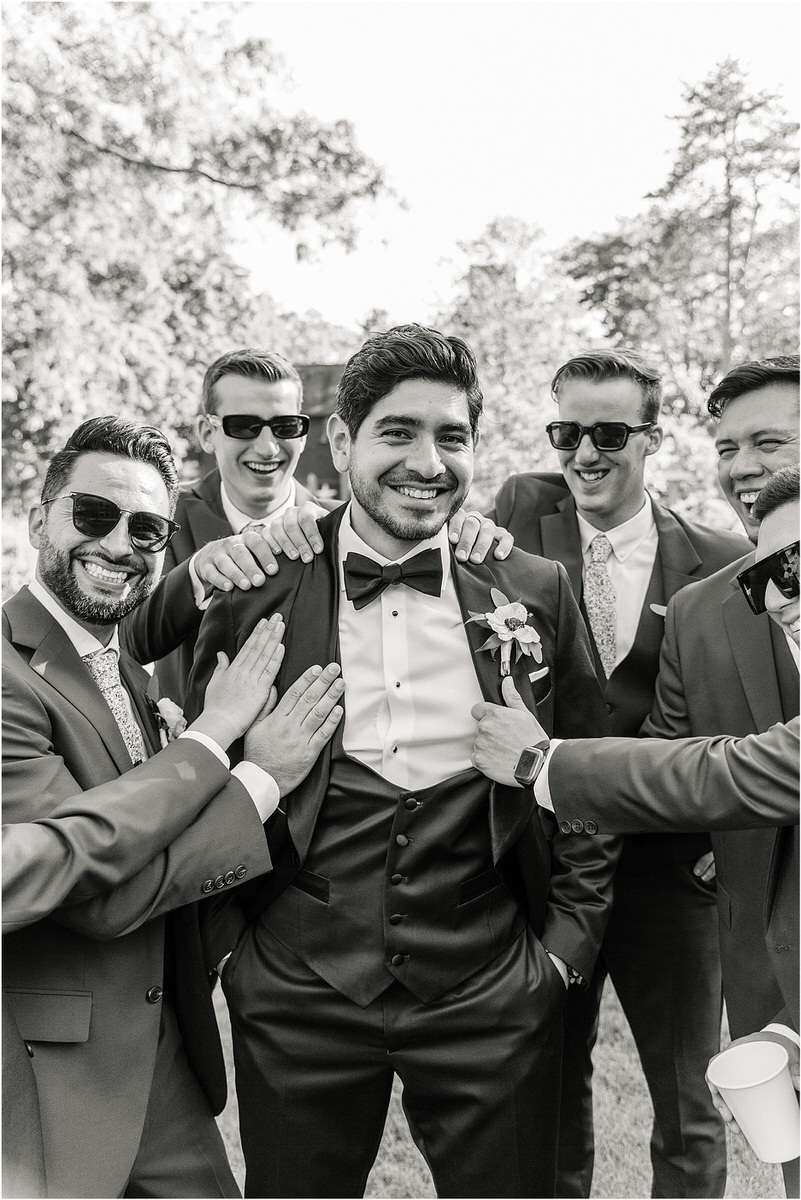 Groom smiles big with family and friends close by for Rachel Campbell Photography