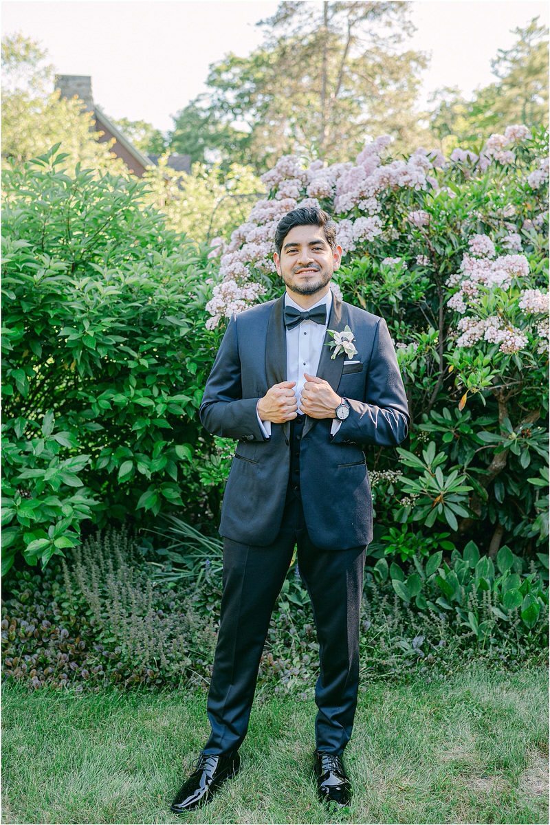 Groom adjust wedding day attire for Rachel Campbell Photography