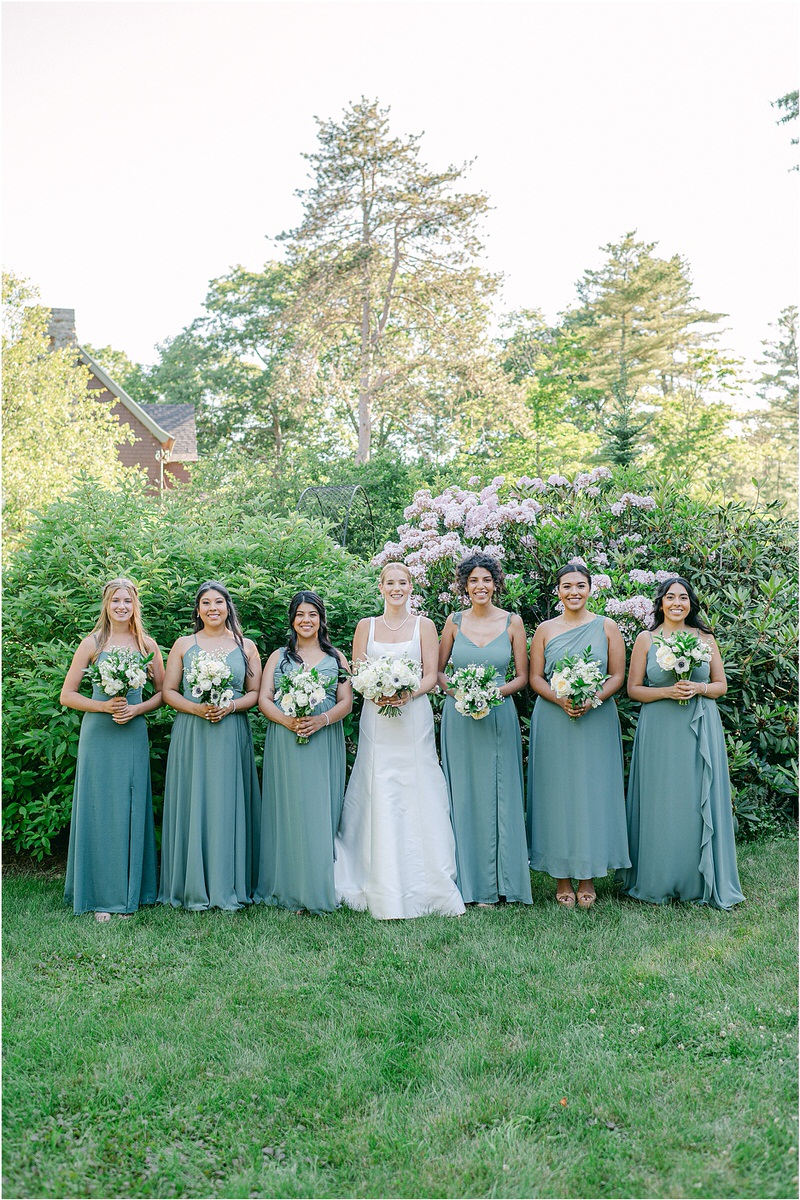 Bride stands with bridesmaids for Rachel Campbell Photography