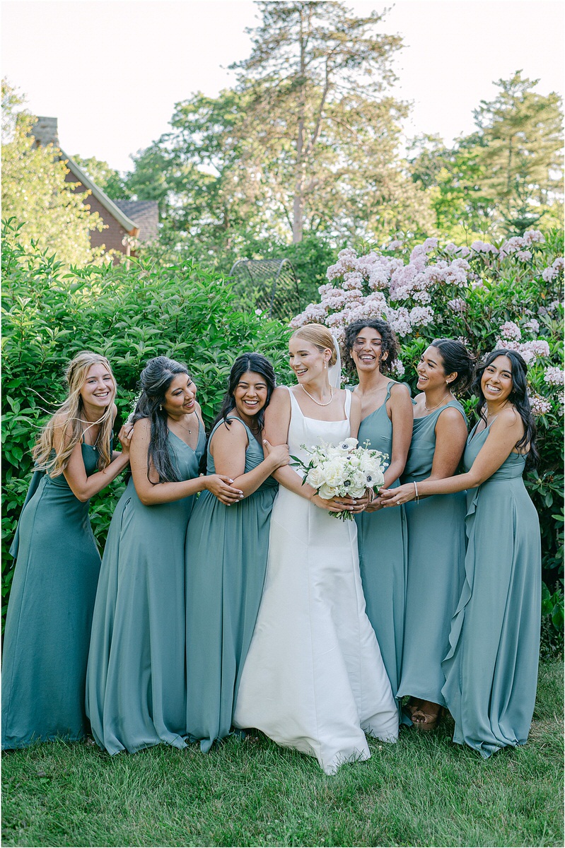 Bride laughs and smiles with bridesmaids for Rachel Campbell Photography
