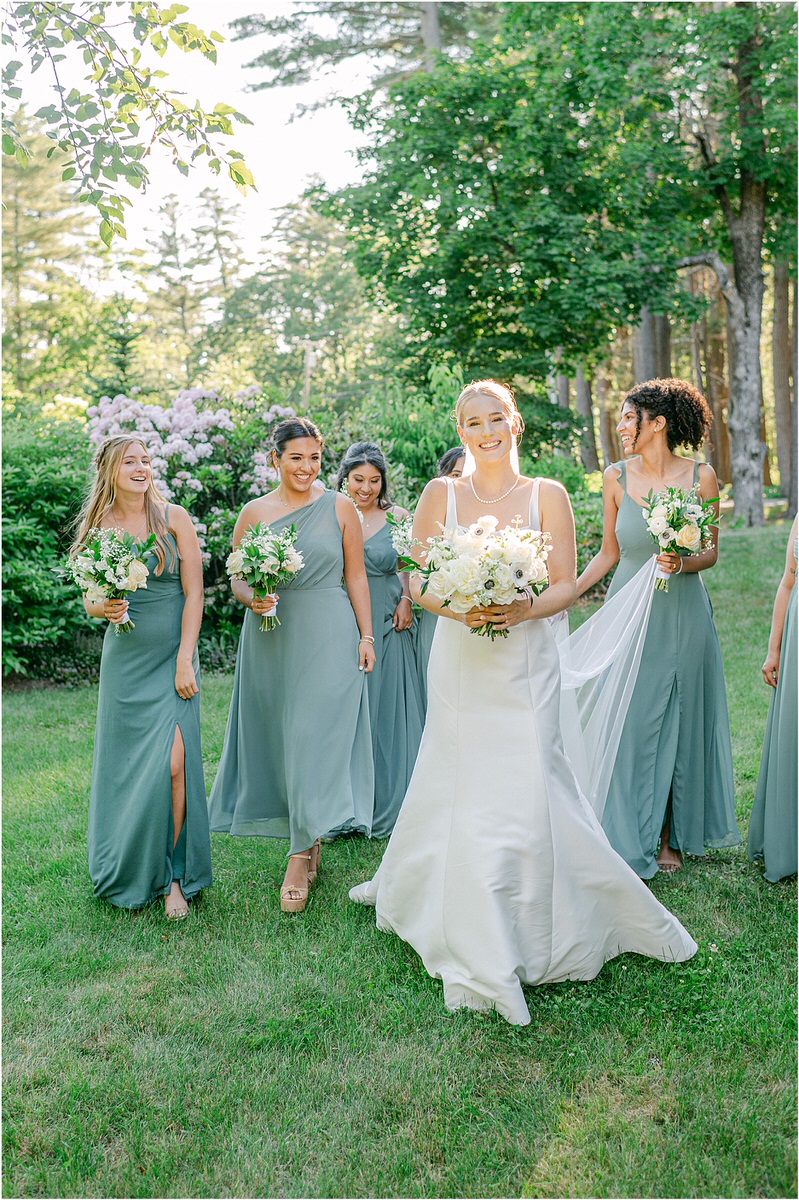 Brides walks with bridesmaids for Rachel Campbell Photography