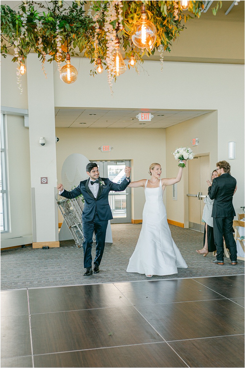 Happy couple enter reception area for Rachel Campbell Photography