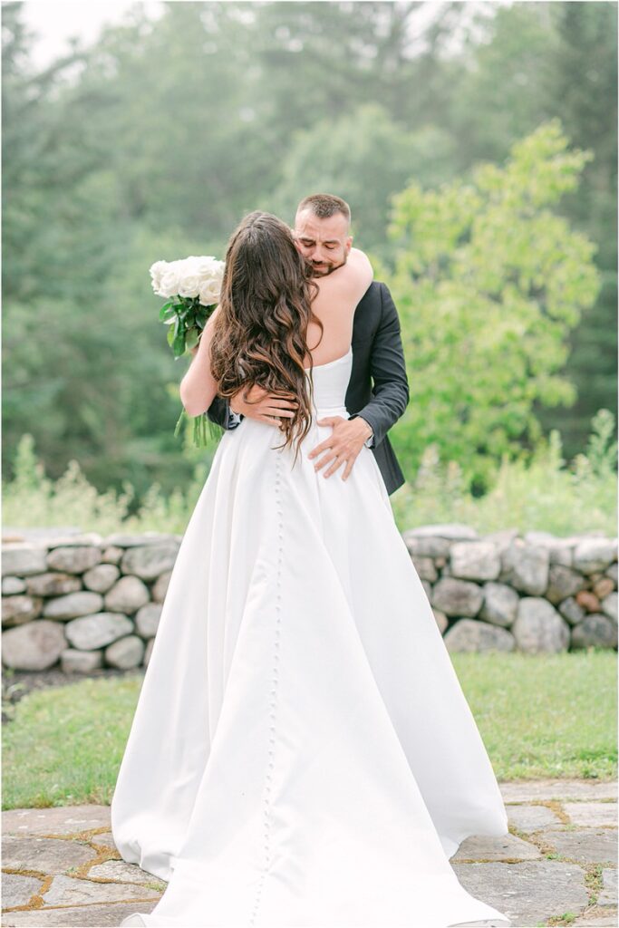Man and woman hugs each other for Owls Head, ME Wedding 
