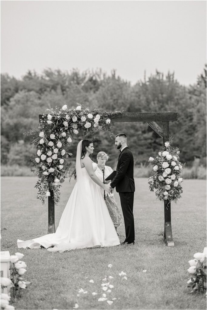 Man and woman hold hands for Owls Head, ME Wedding 