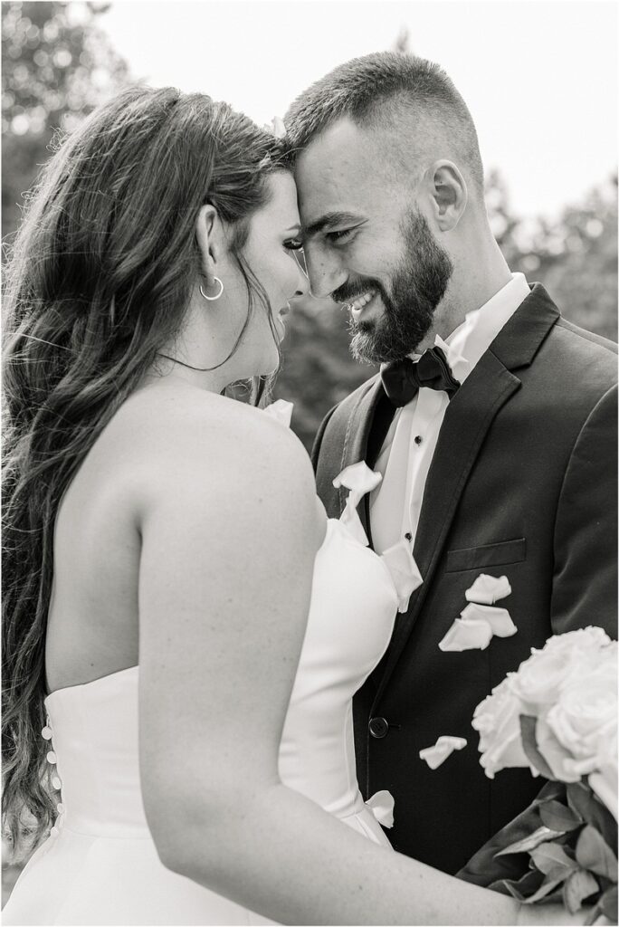 Man and woman hold one another close for Owls Head, ME Wedding 
