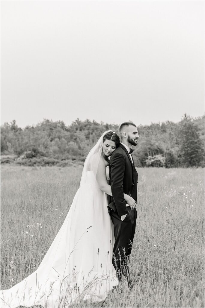 Wife holds groom for Owls Head, ME Wedding 