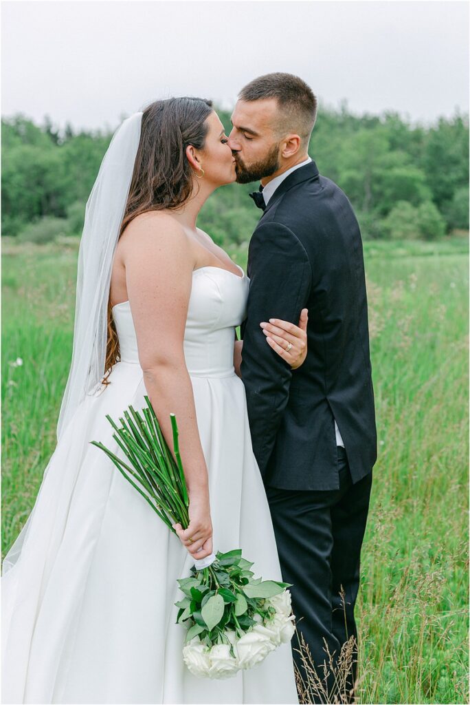 Husband and wife share a kiss for Owls Head, ME Wedding 