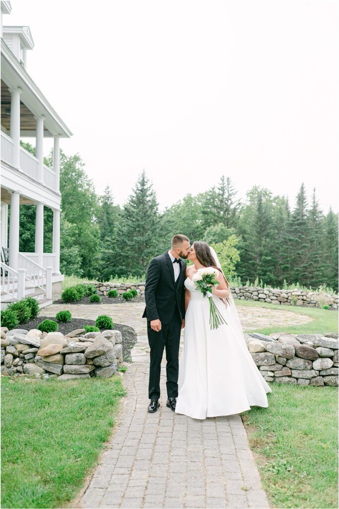 Man and woman share a kiss for Summer Maine Wedding