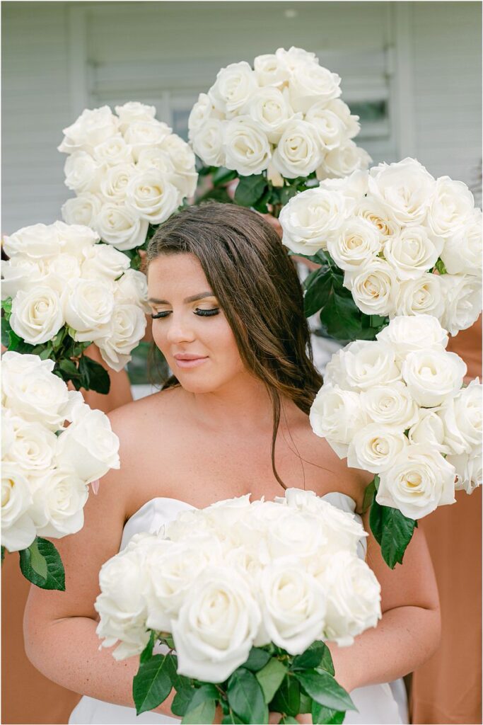 Gorgeous bouquets surround bride for Summer Maine Wedding