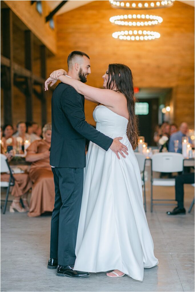 Brode and groom share a dance for their Maine Barn Wedding