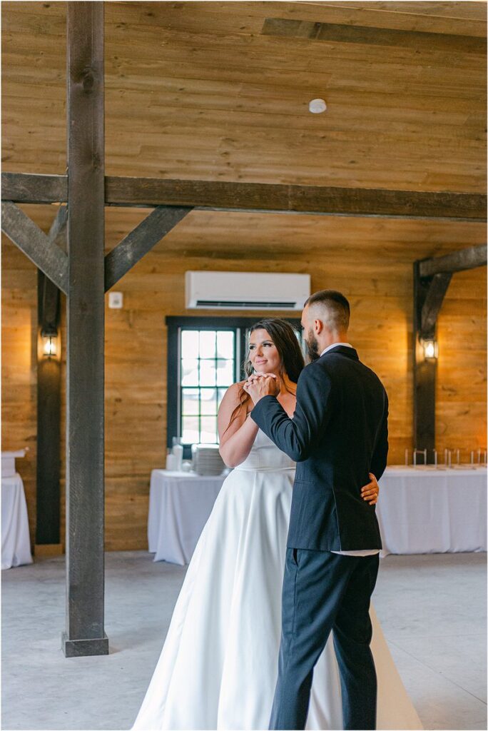 Husband and wife dance together for Maine Barn Wedding