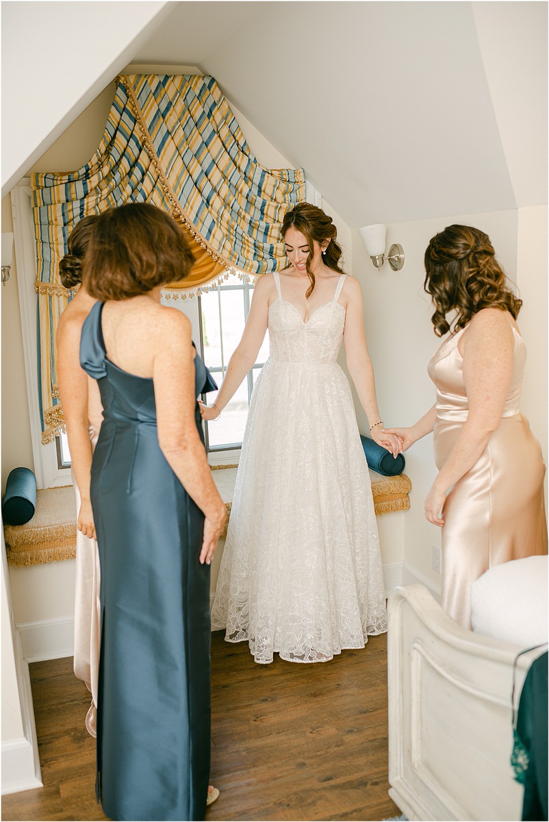 Woman stands with family and friends for wedding at Bar Harbor Club