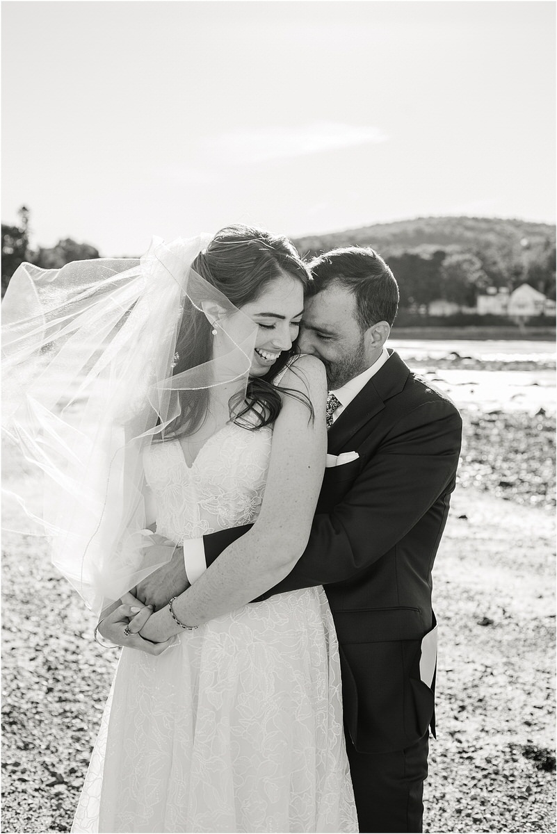 Bride and groom hold one another close for wedding at Bar Harbor Club