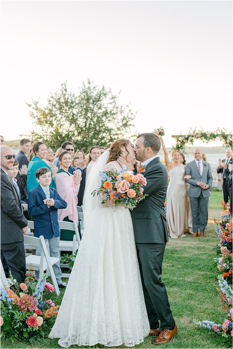Bride and groom share a kiss during Maine Fall Wedding