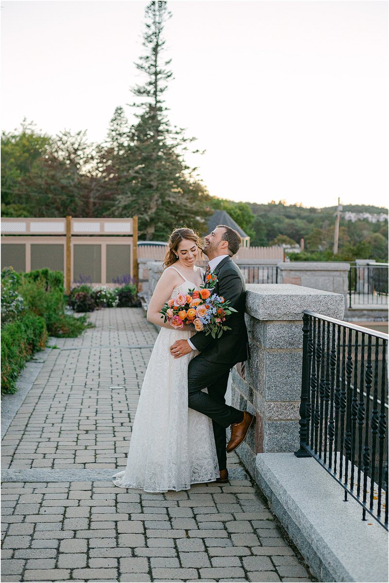 Husband and wife laugh together for Maine Fall Wedding