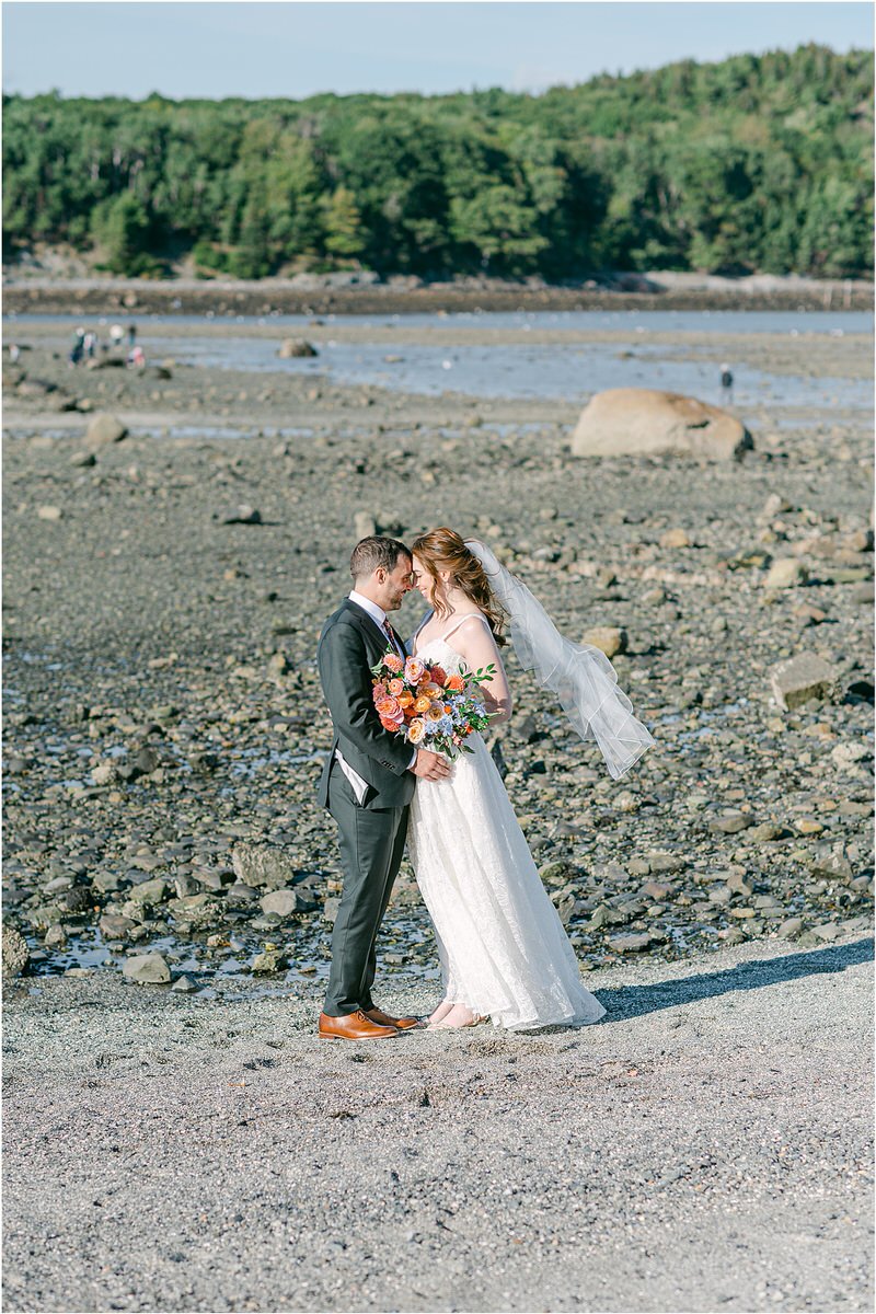 Couple hold each other close for Maine Fall Wedding