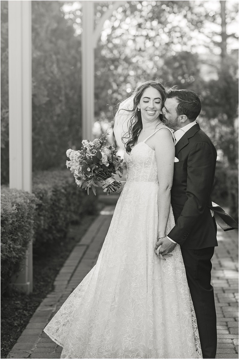 Man kisses woman on the cheek for Maine Fall Wedding