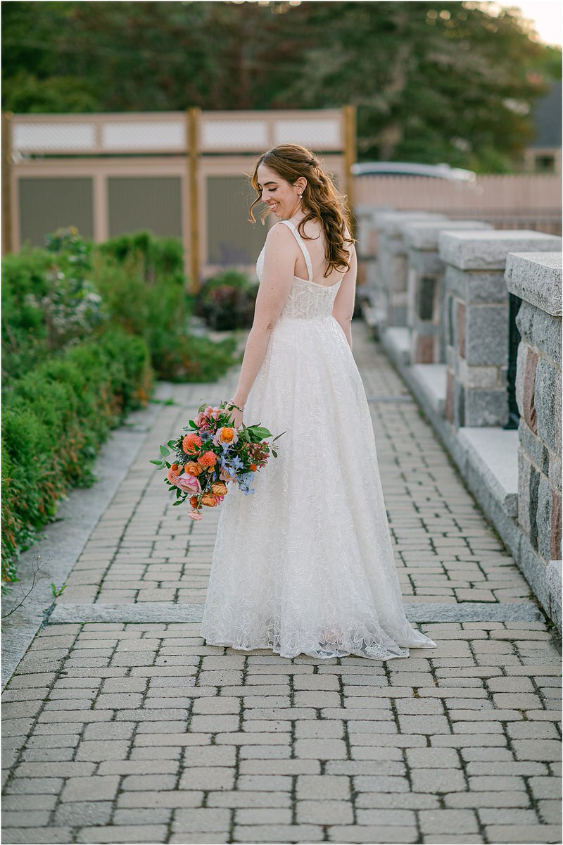 Bride walks with colorful bouquet for Maine Fall Wedding