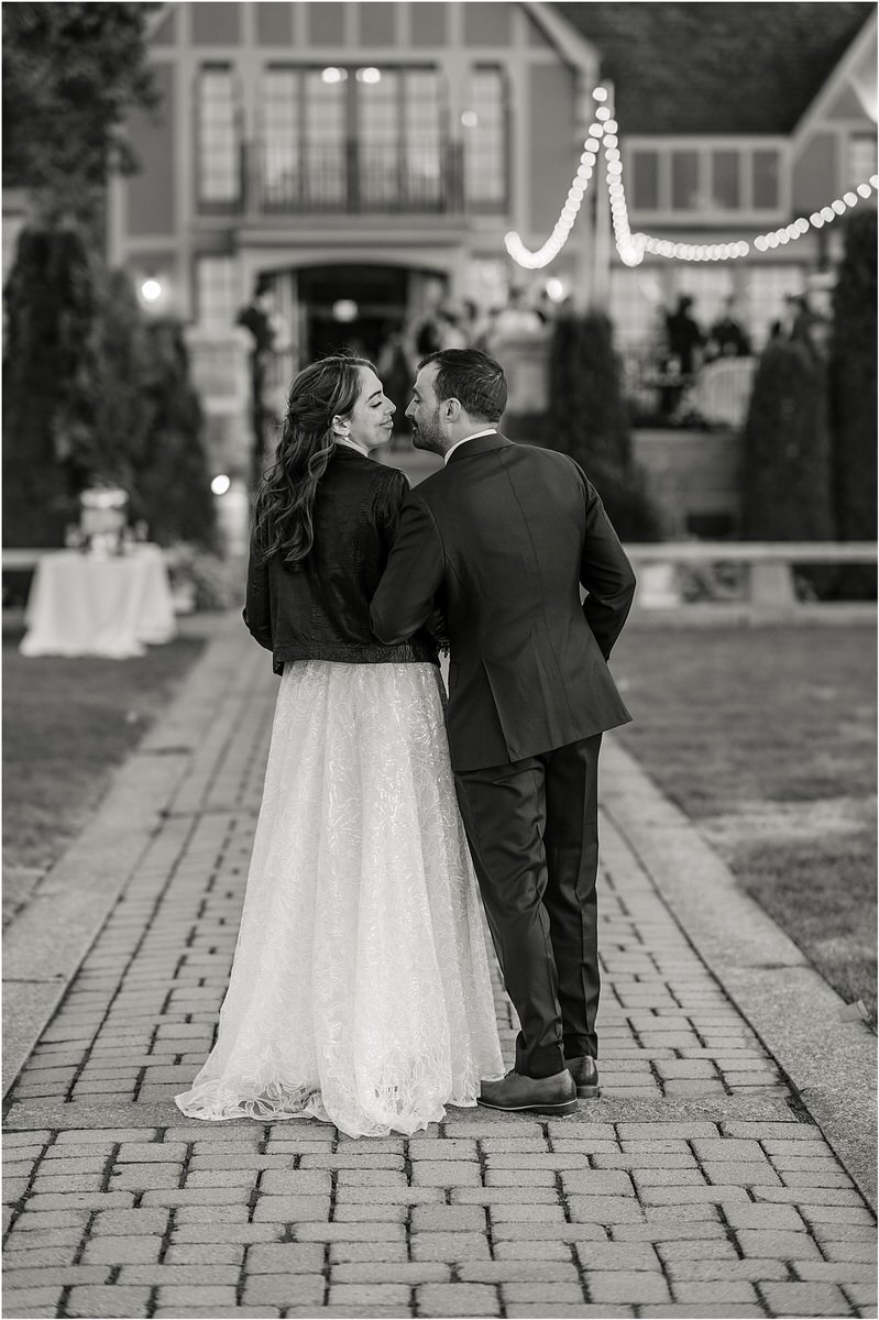 Husband and wife walk to reception for Maine Fall Wedding