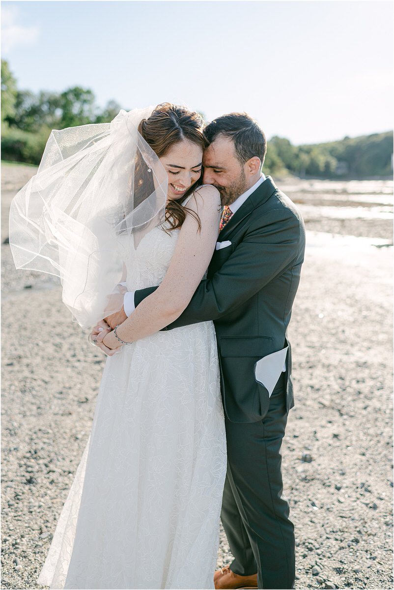 Couple hold each other close for Maine Fall Wedding