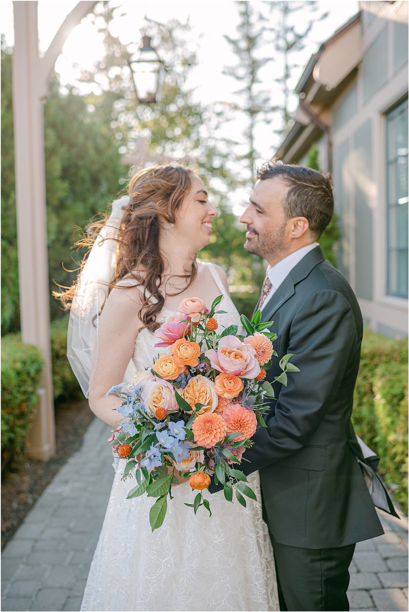 Bride and groom smile together for Maine Fall Wedding