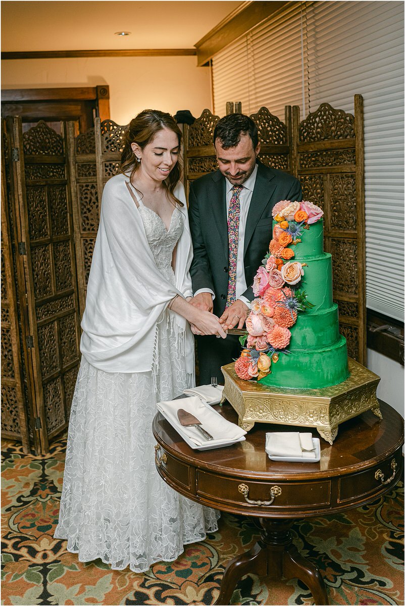 Couple cut the cake for Rachel Campbell Photography