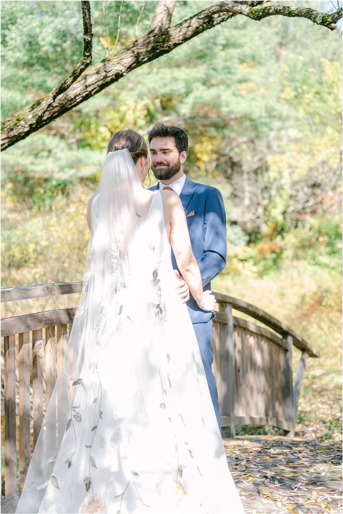 Husband and wife stand together at Beech Ridge Barn