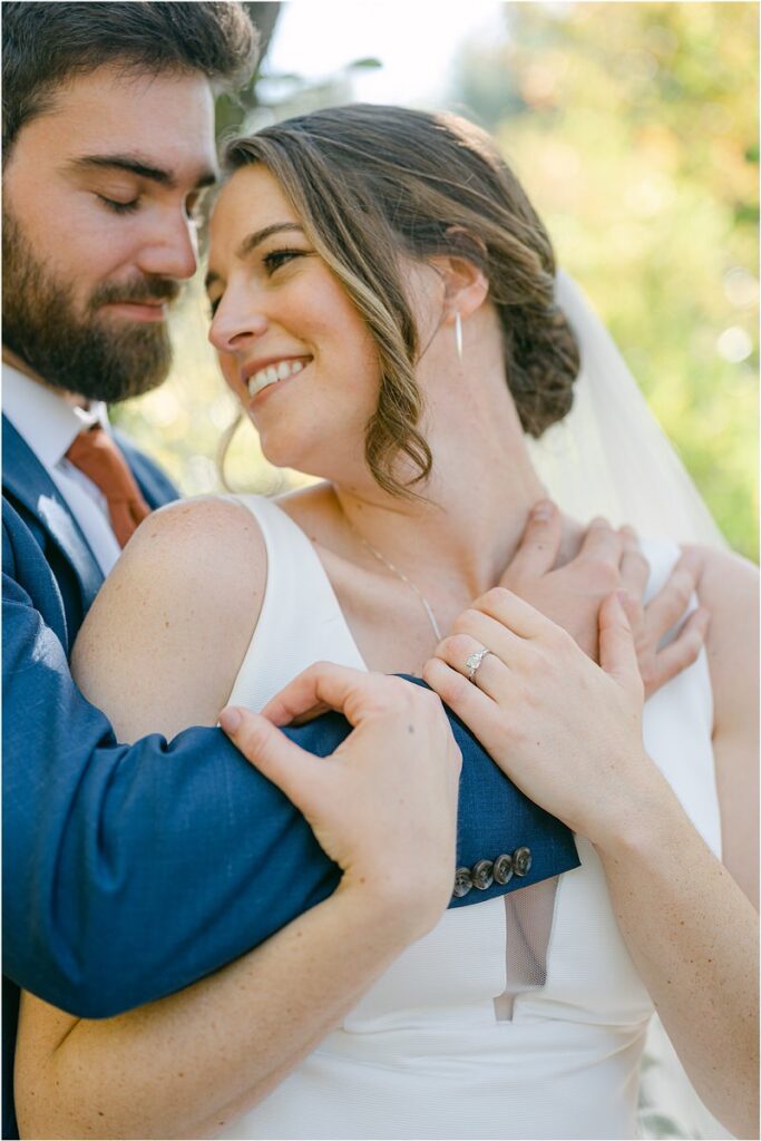 Bride hold groom close at Beech Ridge Barn