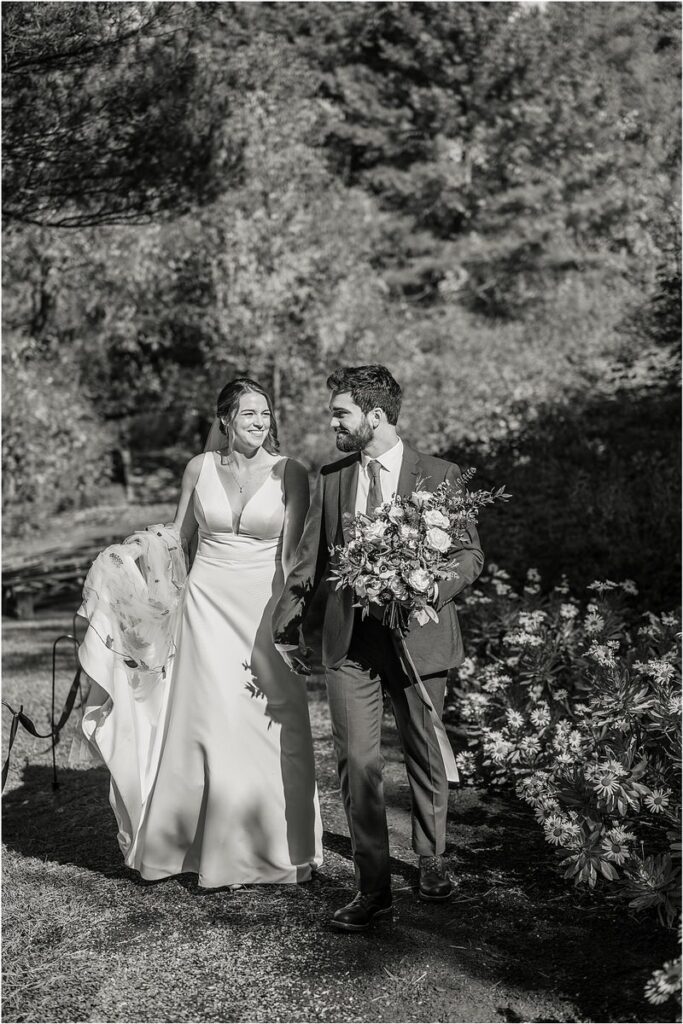 Bride and groom stand close together at Beech Ridge Barn