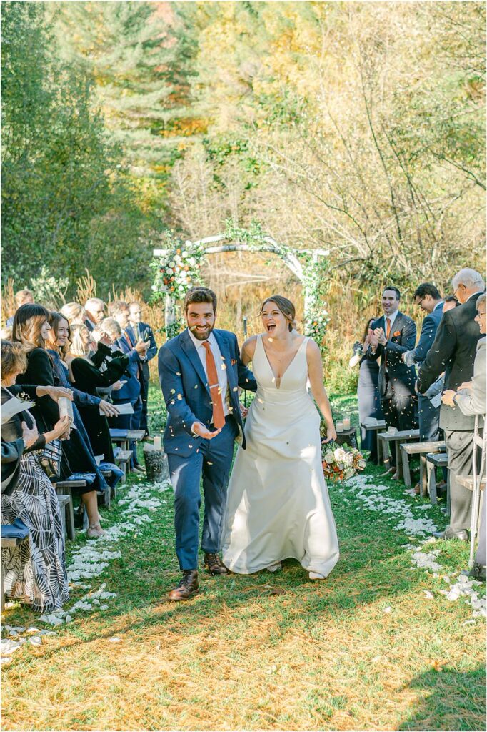 Happy couple walk together at Beech Ridge Barn