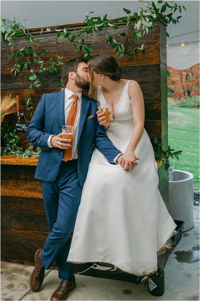 Husband and wife share a kiss for Rachel Campbell Photographyhel Cam