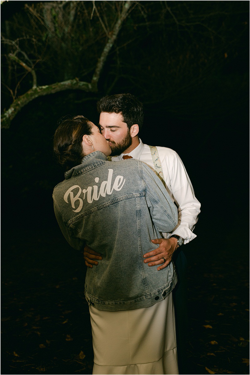 Husband and wife share a kiss for Rachel Campbell Photographyhel Cam