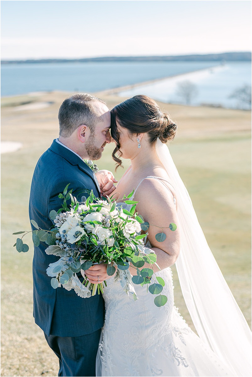 Couple stand close together for wedding at Samoset Resort