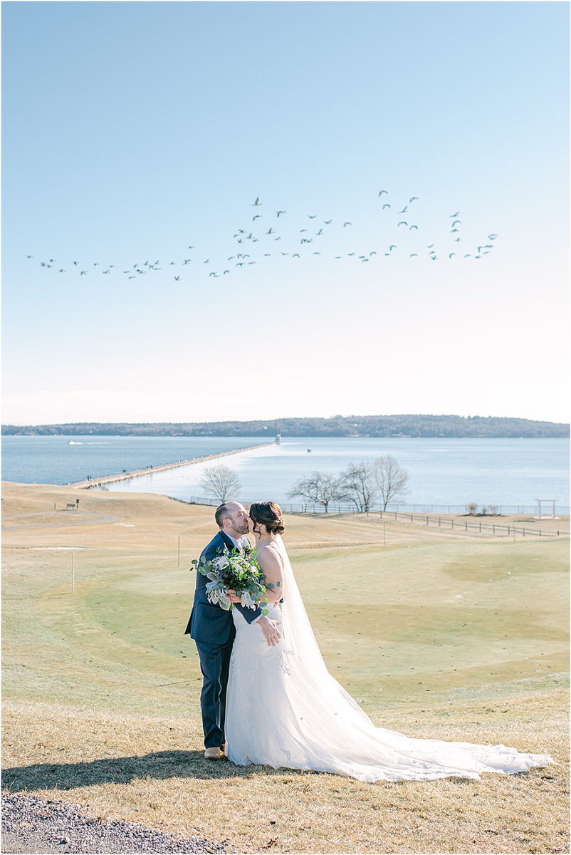 Bride and groom share a kiss for wedding at Samoset Resort
