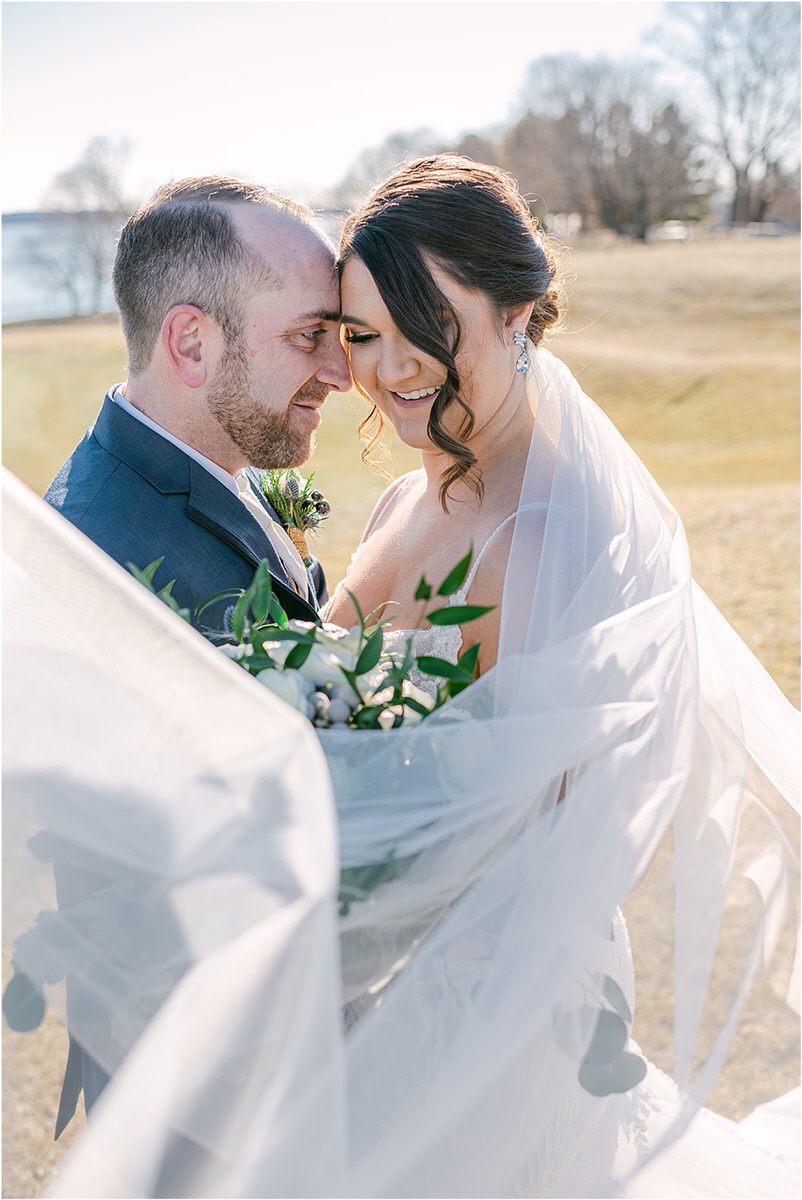 Husband and wife smile together for wedding at Samoset Resort