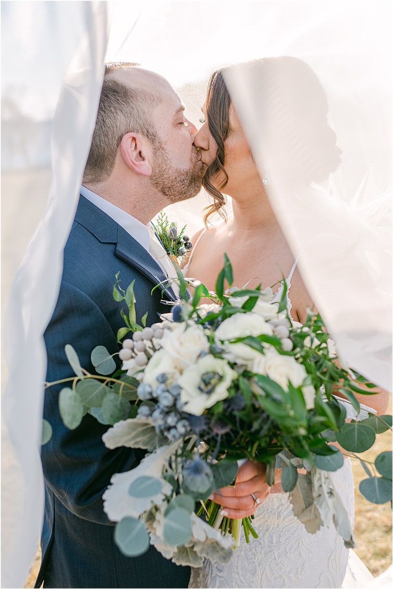 Couple share a kiss for wedding at Samoset Resort