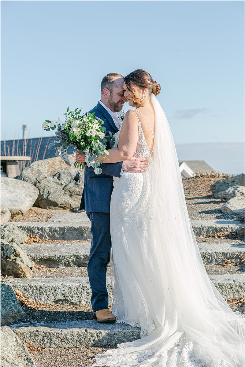 Bride and groom hold each other close for wedding at Samoset Resort