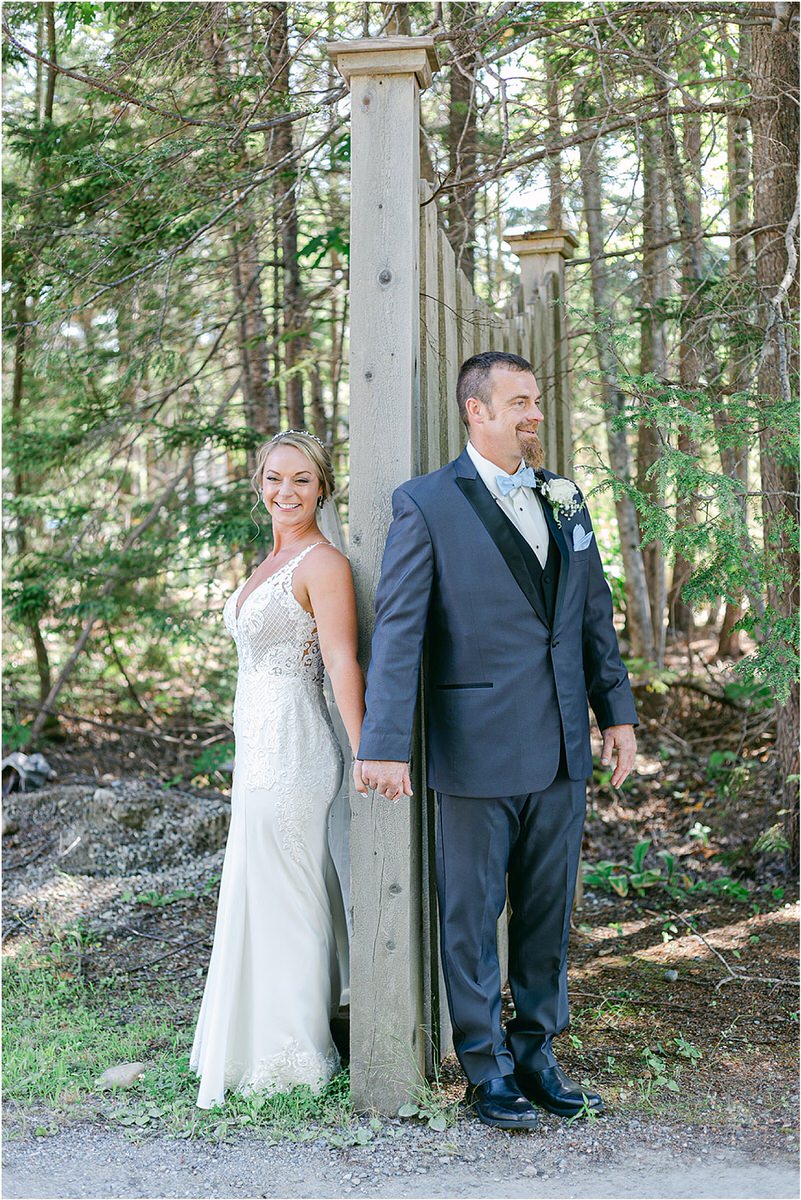 Husband and wife stand together at Spruce Point Inn