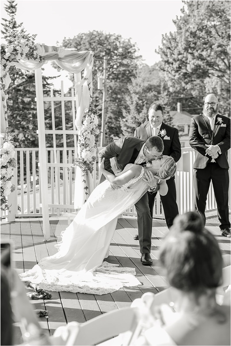 First kiss as husband and wife at Spruce Point Inn