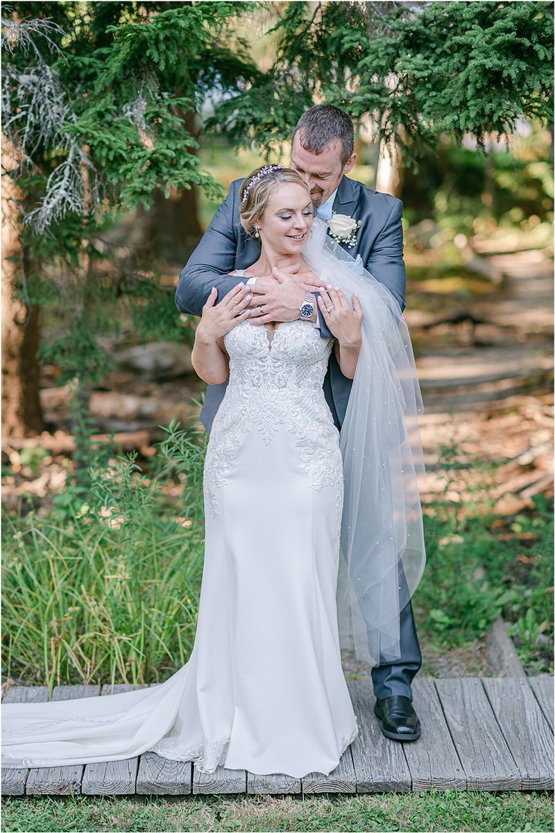 Couple hug each other at Spruce Point Inn