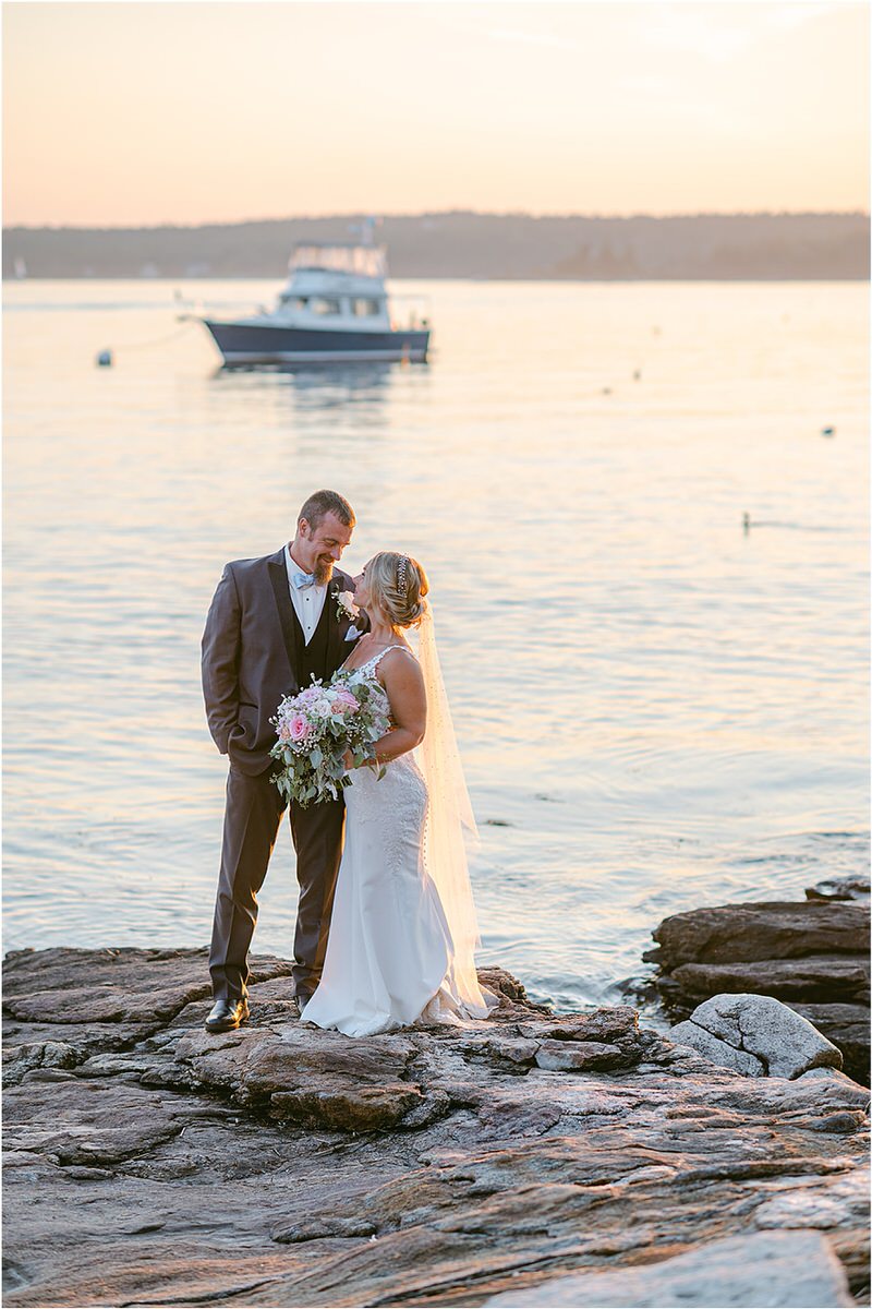 Husband and wife stand together at Spruce Point Inn