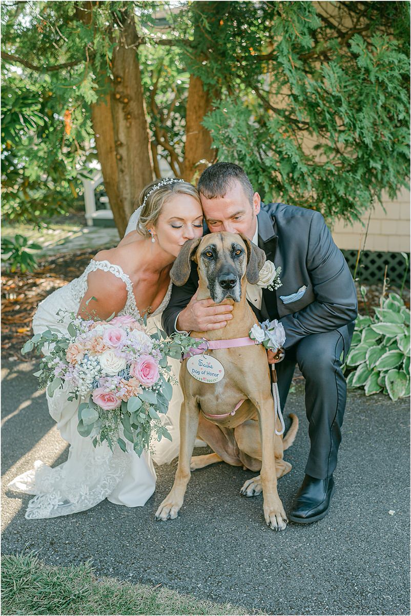 Couple share a kiss with their dog for Rachel Campbell Photography