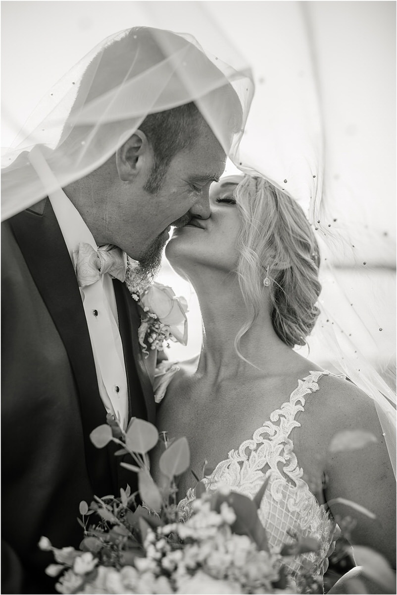 Husband and wife share a kiss for Rachel Campbell Photography