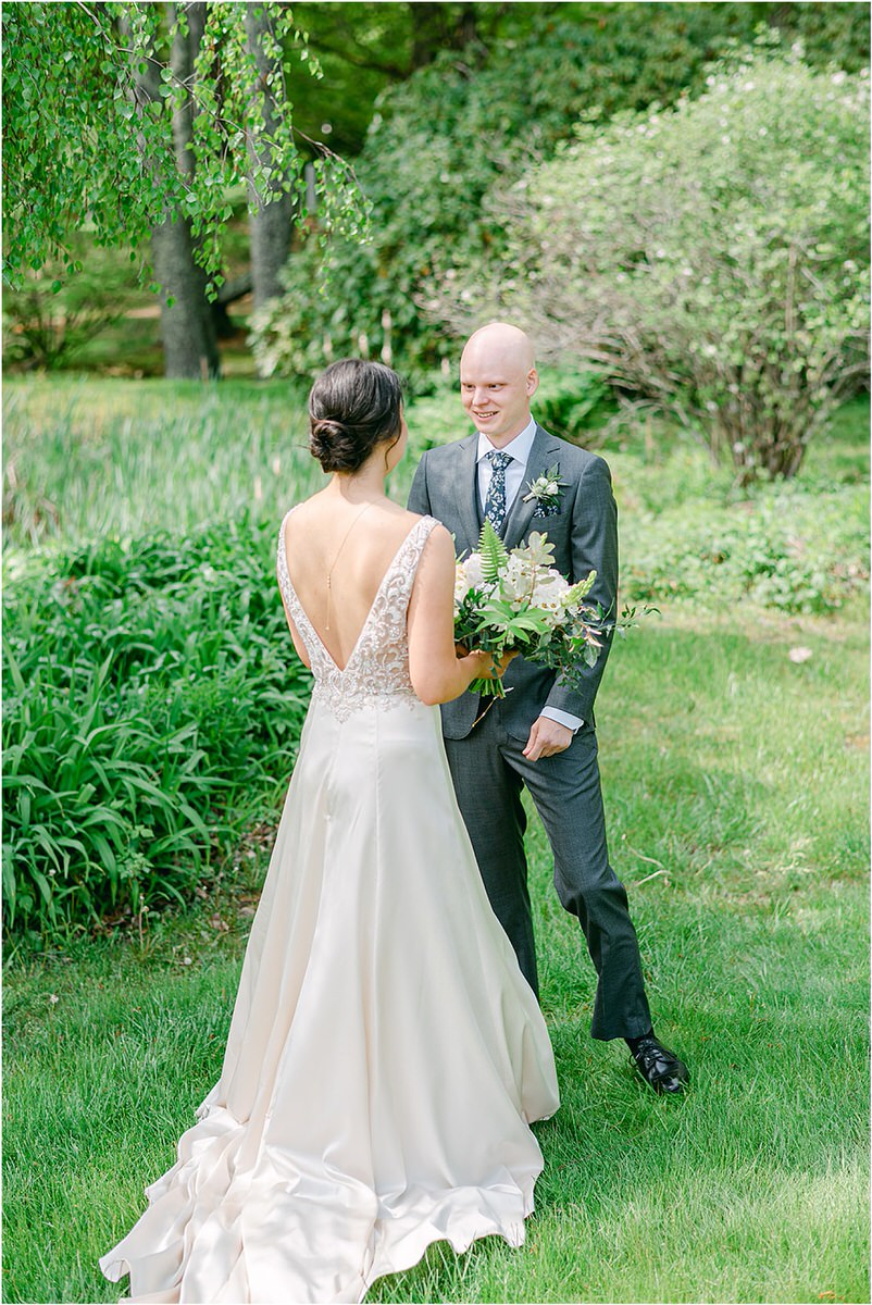 Husband wife smile at one another for wedding at The 1812 Farm