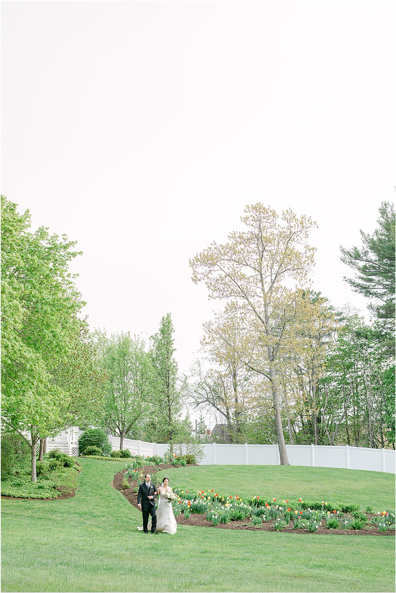 Bride walks to wedding ceremony for wedding at The 1812 Farm